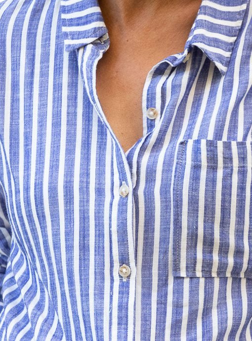 blue and white striped button down shirt with distressed denim