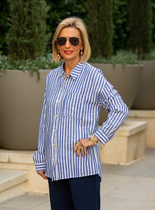 blue and white striped button down shirt with distressed denim